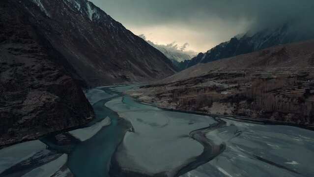Aerial view of Hussaini Suspension bridge and village. Drone view of Hunza Valley