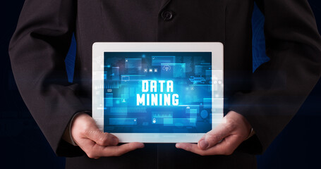 Person holding tablet, security concept