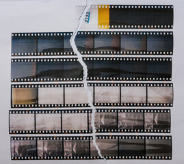 35mm filmstrips printed on white torn copy paper, cool cover or poster idea, empty or blank film material.