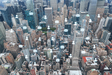 Fototapeta na wymiar Aerial panoramic roof top city view of New York City Financial Downtown district at day time. Manhattan, NYC, USA. Social media hologram. Concept of networking and establishing new people connections