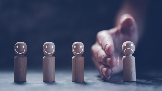 risk management  concept, hand separating wooden people from group show how to manage the risk and conflict