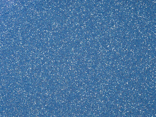 Soft blue, navy, sapphirine, indigo color glitter texture. Sparkling, shiny background for Christmas or xmas holiday seasonal wallpaper decoration, greeting and wedding invitation card design element.