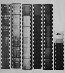 long blank 35mm black and white film strips printed on white copy paper with empty frames.
