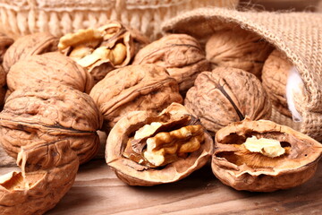 Group of walnuts arranged on wooden planks. Healthy food.
