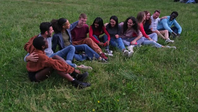 Friends from different countries of birth together and united by multiculturalism in an afternoon in the park. Concept: Lifestyle, diversity, friendship