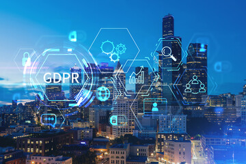 Illuminated aerial cityscape of Seattle, downtown at night time, Washington, USA. GDPR hologram, concept of data protection regulation and privacy for all individuals