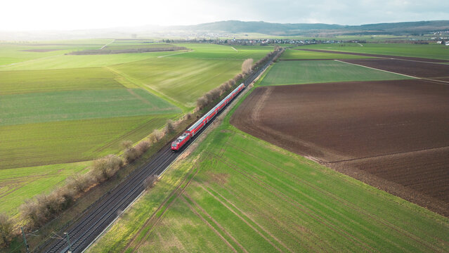 high angle view of a train on the railway between the fields in the the countryside