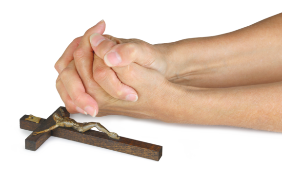 Praying for Peace at Easter - female hands in prayer position laid next to a wooden crucifix isolated transparent png file
