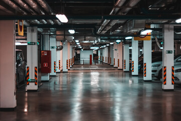 Parking in a residential complex. Engineering communications inside the building. Pipes with thermal insulation