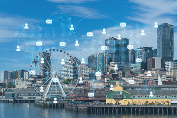 Fototapeta na wymiar Seattle skyline with waterfront view. Skyscrapers of financial downtown at day time, Washington, USA. Social media hologram. Concept of networking and establishing new people connections