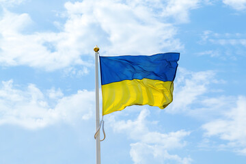 Ukrainian national blue and yellow colors flag waving in the wind against blue sky.Ukraine National government patriotic symbol,Independence,Constitution day