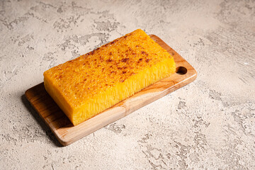 Bika ambon or golden cake or golden kuih bingka in Singapore, is an Indonesian dessert, made from...