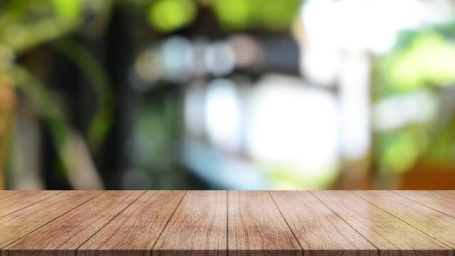 Empty wooden table top with lights bokeh on blur restaurant background.	
