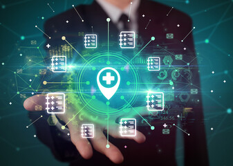 Hand holding healthcare icons concept