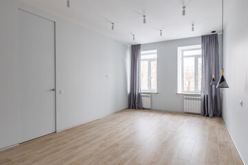 Empty gray room ready for people to move in