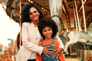 Kids having fun on a carnival Carousel