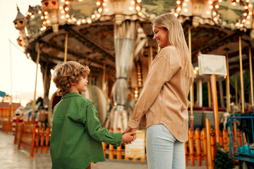 Kids having fun on a carnival Carousel