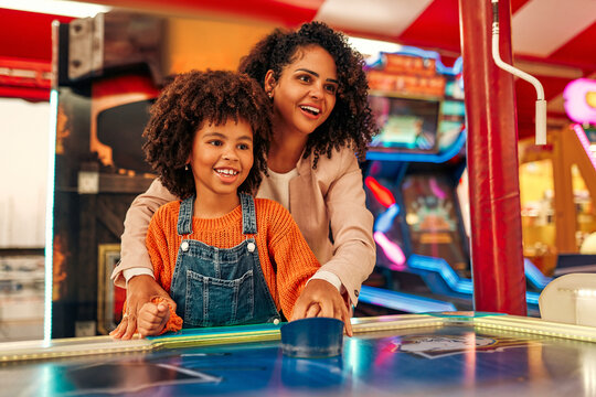 Kids Having Fun On A Carnival Carousel