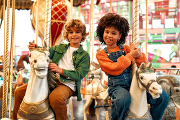 Kids having fun on a carnival Carousel © Valerii Apetroaiei