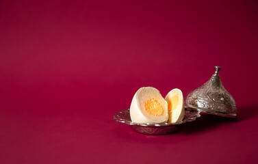 Easter cake in the shape of an egg, made from sponge crumbs mixed with cream, yolk of orange jelly, the cake itself is covered with white Belgian chocolate. a great alternative to baking Easter cakes.