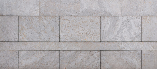 natural stone wall texture as background. Close-up of a wall clad in limestone