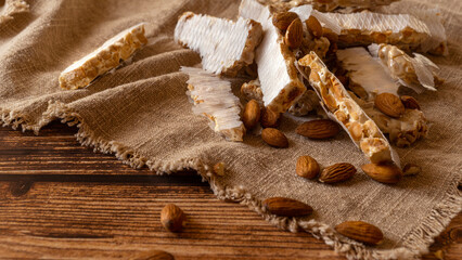 Heap of Almond Spanish turron dessert slices with nuts