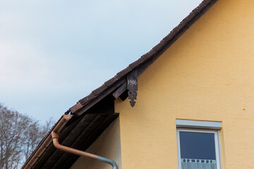 Roof of renovated old farmhouse in Gaishaus near Ravensburg in Baden-Würtemberg with the year of...