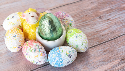 Obraz na płótnie Canvas Funny Easter background with bunny, sheep and Easter eggs. Letter of wishes for Easter. With cospyspaces