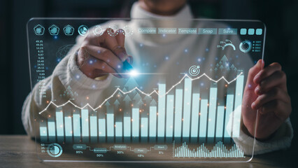 Analyst working on business analytics dashboard with KPI, charts and metrics to analyze data and...