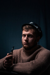 Vessel captain. A man in a sweater and cap. Smokes a pipe. Male profession.