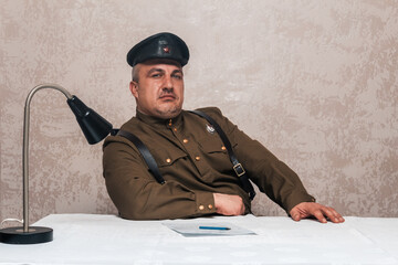 Soldier of the Russian army of the 20th century. Civil service officer in a cap, military uniform...