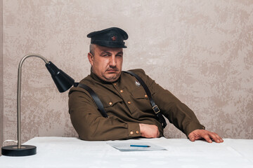 Soldier of the Russian army of the 20th century. Civil service officer in a cap, military uniform...