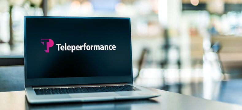 Laptop computer displaying logo of Teleperformance