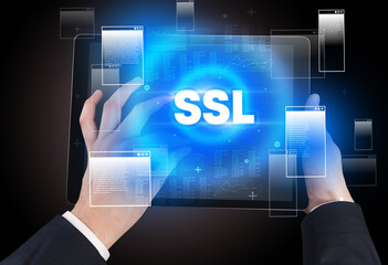 Close-up of a hand holding tablet