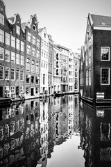 Old houses by canal in Amsterdam