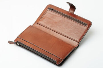 Open empty brown leather wallet