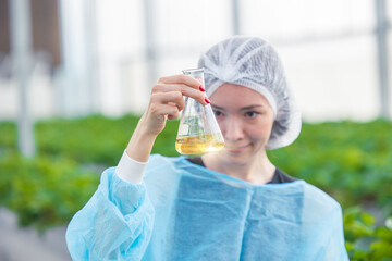 scientist working in organic agriculture farm research new chemical formula extract from plant for medical concept.