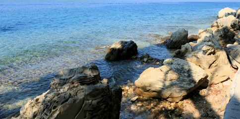 Fototapeta na wymiar stones in the blue sea, island Rab, Croatia