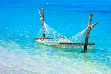 Poster Tropical chilling out - hammock in turquoise water in Maldive islands. exotic tropics holidays © Freesurf