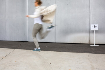 Woman rushing to a bathroom, toilet, hygiene, restroom. WC urgency concept.