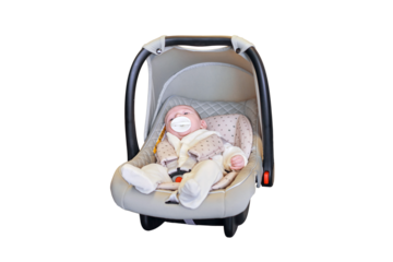 A newborn baby in a carrier, isolated on a white background. The child in the infant car seat. Kid aged two months