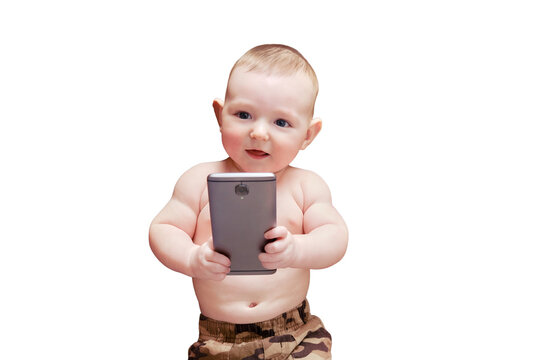 Funny happy baby boy with a phone in his hands. Smiling child holds a smartphone, isolated on a white background