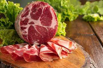 Capocollo or coppa is a traditional Italian and Corsican pork cut made from cured pork shoulder or neck. . Cut into very thin slices. Italian delicacy for aperitivo. Piacentina DOP. 