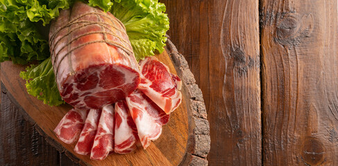 Capocollo or coppa is a traditional Italian and Corsican pork cut made from cured pork shoulder or neck. . Cut into very thin slices. Italian delicacy for aperitivo. Piacentina DOP. 