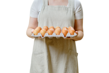 A woman holds a package with a lot of eggs standing on a home kitchen, isolated on a white background