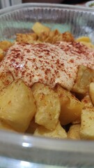 Typical Spanish spicy fried potatoes in hot sauce. Patatas Bravas