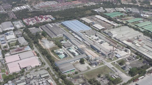 Aerial view of industrial buildings and granite factories nearby greenery