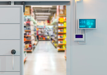 Freezer for supermarket. Entrance to supermarket from refrigerated warehouse. Minus temperature sensor on wall. Gate to freezer warehouse. Freezer systems for supermarket. Art blurred. 3d image. - obrazy, fototapety, plakaty