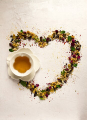 tea set, heart-shaped, with a cup, top view, on a white background, rosebuds, jasmine, blue, chrysanthemum, mint leaves,