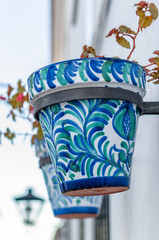 Flower pots decorating typical Andalusian houses in Mijas, Spain
